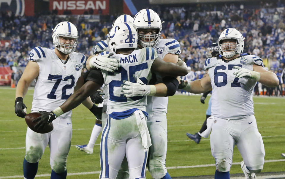 Indianapolis Colts running back Marlon Mack (25) celebrates with teammates after scoring a touchdown on an 8-yard run against the Tennessee Titans in the second half of an NFL football game Sunday, Dec. 30, 2018, in Nashville, Tenn. The Colts won 33-17. (AP Photo/James Kenney)