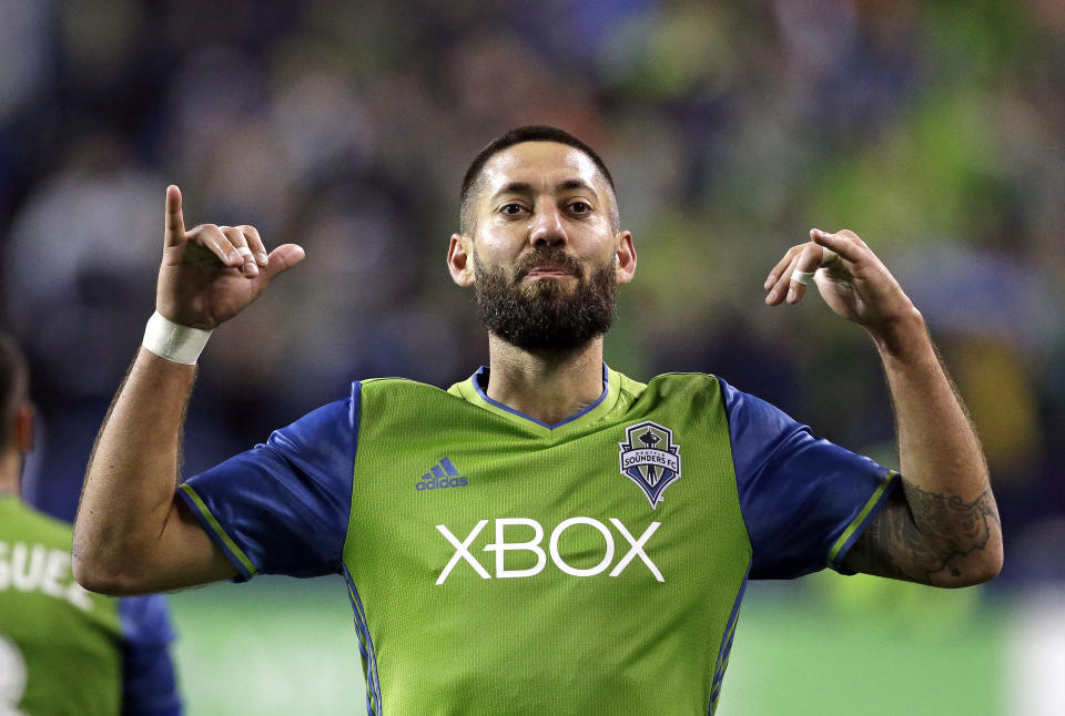 FILE - Seattle Sounders' Clint Dempsey motions to fans after scoring the second of his two goals against the Vancouver Whitecaps during the second half of the second leg of an MLS soccer Western Conference semifinal, Thursday, Nov. 2, 2017, in Seattle. Clint Demspey thinks American goalkeepers Zack Steffen and Matt Turner should consider going on loans for the start of next season to get sharp ahead of the World Cup if they are not going to be playing regularly for their Premier League clubs. (AP Photo/Elaine Thompson, File)