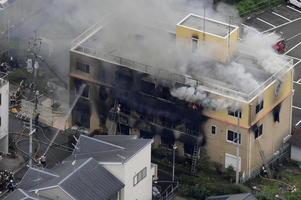 Smoke billows from a three-story building of Kyoto Animation in a fire in Kyoto (AP)