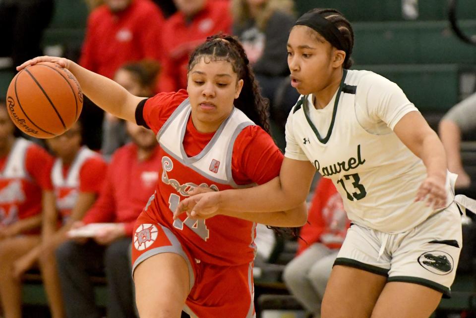 Canton South's Doriana Hastings-Peterson gets pressure from Laurel's Nyla Edwards in the first quarter of OHSAA Division II District Semifinals at Nordonia High School. Wednesday, February 28, 2024.