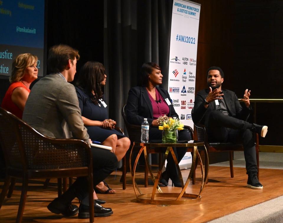 Josh Marcus of The Independent, Michelle Cirocco of Televerde, Tomika Daniel of Bailees Logistics, Malika Kidd of Lutheran Metropolitan Ministries, and Daniel Forkkio of Represent Justice on a panel discussion at the American Workforce and Justice Summit (Abby Diebold / Responsible Business Initiative for Justice)