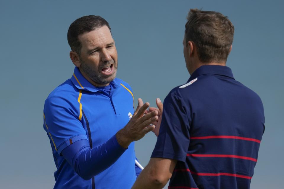 Team Europe's Sergio Garcia shakes hands with Team USA's Jordan Spieth after winning their foursome match the Ryder Cup at the Whistling Straits Golf Course Friday, Sept. 24, 2021, in Sheboygan, Wis. (AP Photo/Ashley Landis)