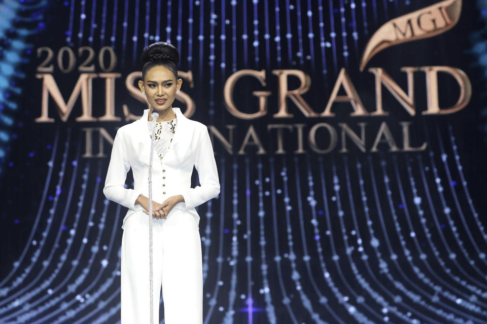 In this photo provided by Miss Grand International, Miss Myanmar, Han Lay, speaks on stage during Miss Grand International contest Saturday, March 27, 2021, in Bangkok, Thailand. The beauty pageant contestant from Myanmar used her brief moment in the spotlight on Saturday night to appeal for international help for her country, on the worst day for bloodshed since the military there staged its coup almost two months ago.(Miss Grand International via AP)