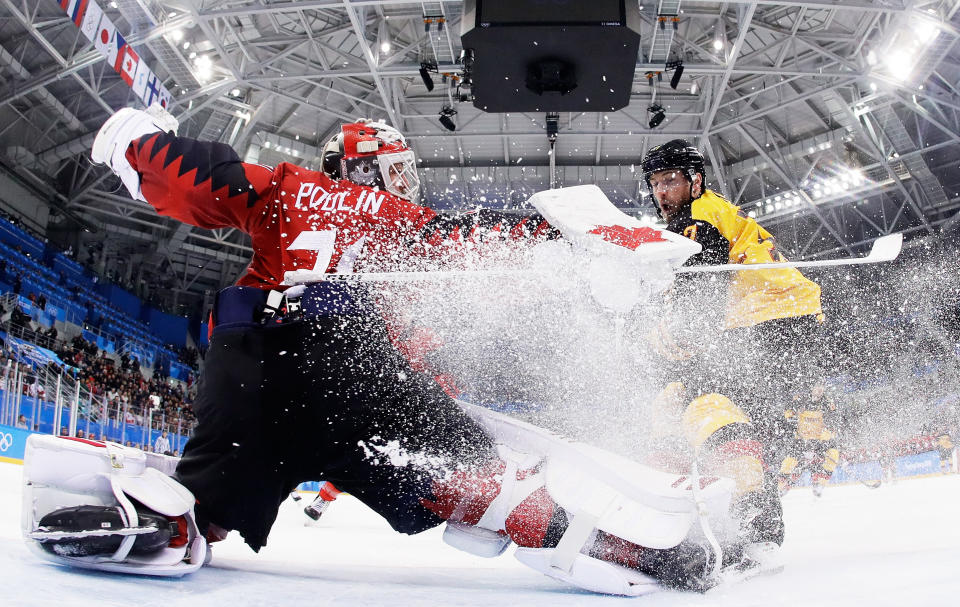 <p>Kevin Poulin #31 of Canada defends against Marcus Kink #17 of Germany during the Men’s Play-offs Semifinals on day 14 of the PyeongChang 2018 Winter Olympic Games in Gangneung, South Korea on February 23, 2018.<br> (Photo by Pool/Getty Images) </p>