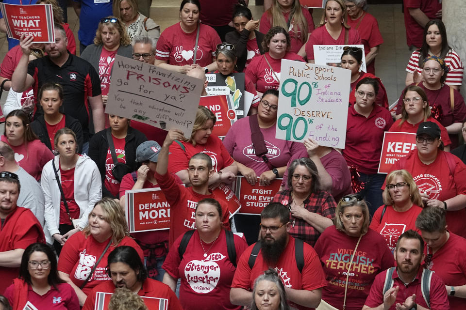 FILE - Teachers and parents attend a rally for teachers at the Statehouse in Indianapolis on Thursday, April 13, 2023. Despite their protest, Indiana joined the slate of states that expanded its programs that use taxpayer money to pay for private school tuition. (AP Photo/Darron Cummings)