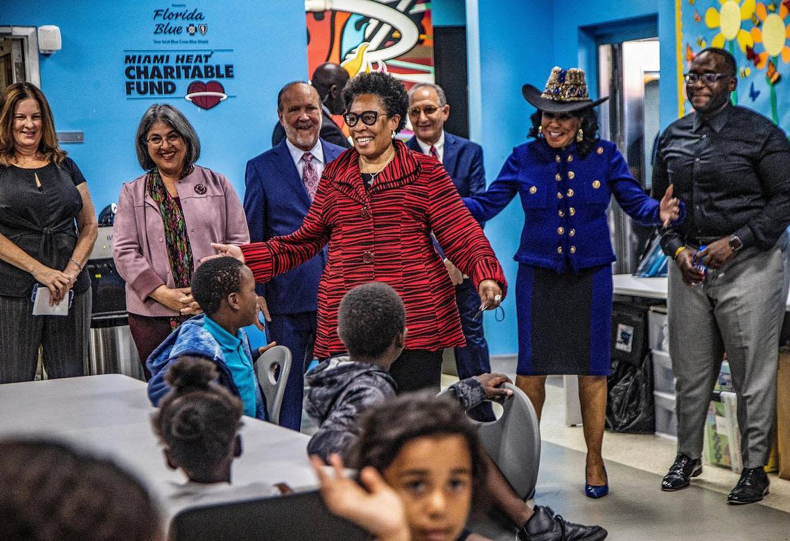 U.S. Department of Housing and Urban Development Secretary Marcia Fudge (center) talks to children while joined by (from left-back) Miami-Dade County Mayor Daniella Levine Cava, Miami-Dade County Homeless Trust Chairman Ronald L. Book and Congresswoman Frederica Wilson, during a walking tour of the Miami-Dade County Homeless Trust assistance center operated by the Chapman Partnership in downtown Miami on June 29, 2022.