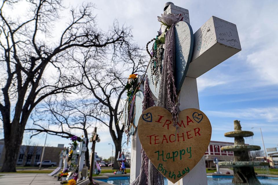 A "Happy Birthday" heart hangs last month on a cross dedicated to Irma Garcia, a teacher who was one of the 21 victims of the 2022 mass shooting at Uvalde's Robb Elementary School.