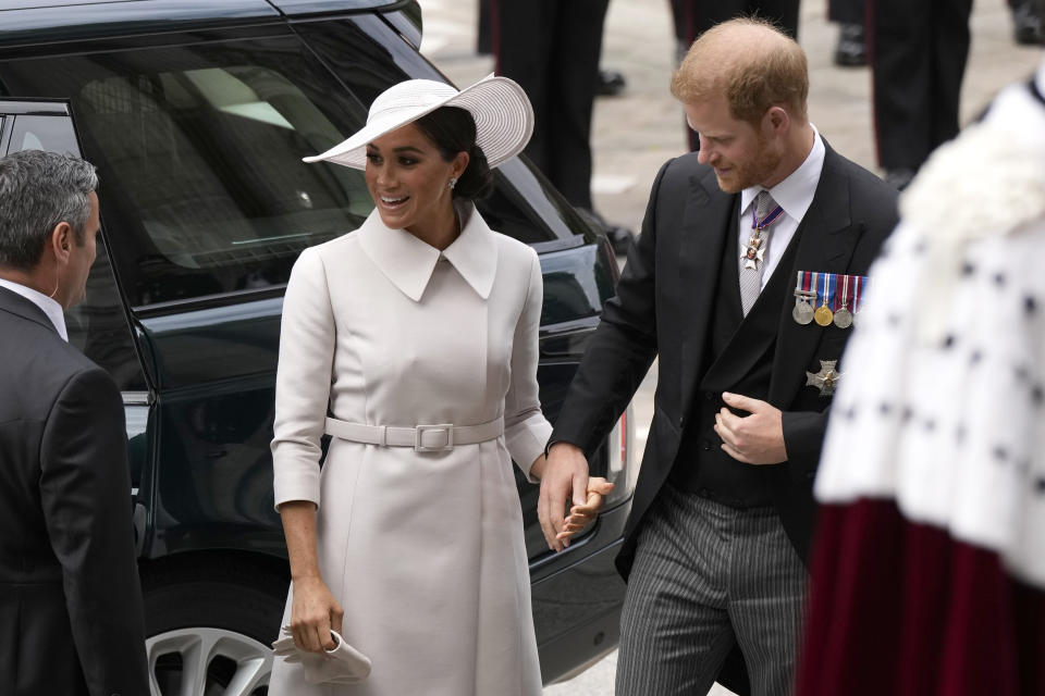 Prince Harry and Meghan Markle, Duke and Duchess of Sussex arrive for a service of thanksgiving for the reign of Queen Elizabeth II at St Paul's Cathedral in London, Friday, June 3, 2022 on the second of four days of celebrations to mark the Platinum Jubilee. The events over a long holiday weekend in the U.K. are meant to celebrate the monarch's 70 years of service. (AP Photo/Matt Dunham, Pool)