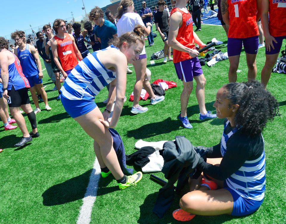 Spring Grove's Natalia Dab and Laila Campbell chat after their 4x100 relay won the Roddick Invitational with the fastest league time of the season.
