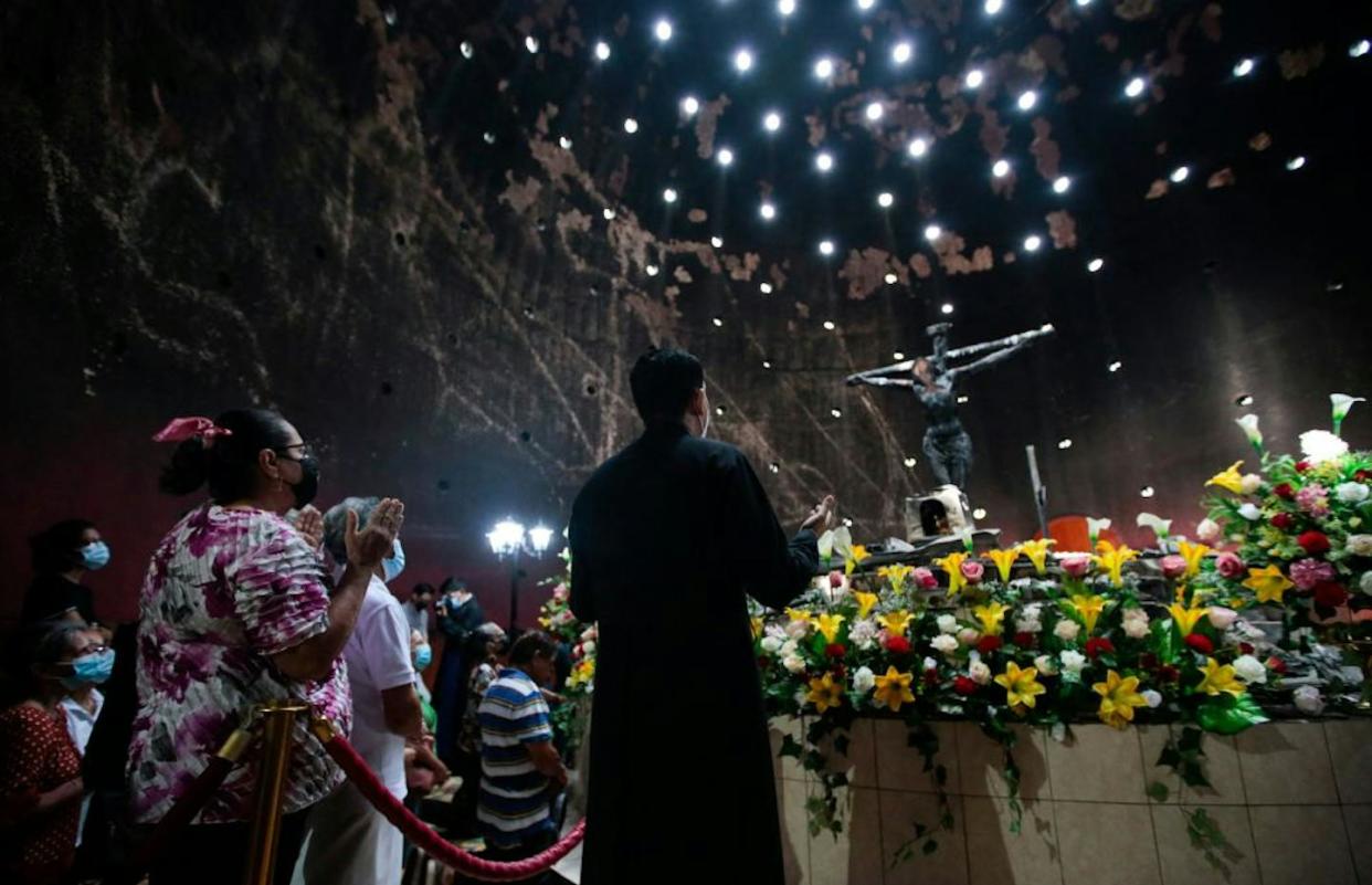 A priest and Catholic worshippers pray in front of an image of 'Sangre de Cristo,' burned in a fire on July 2020, at the Metropolitan Cathedral in Managua. <a href="https://www.gettyimages.com/detail/news-photo/priest-and-catholic-faithful-pray-in-front-of-an-image-of-news-photo/1242786617?adppopup=true" rel="nofollow noopener" target="_blank" data-ylk="slk:Oswaldo Rivas/AFP via Getty Images;elm:context_link;itc:0;sec:content-canvas" class="link ">Oswaldo Rivas/AFP via Getty Images</a>