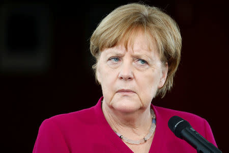 FILE PHOTO: German Chancellor Angela Merkel addresses the media in Berlin, Germany, April 23, 2018. REUTERS/Fabrizio Bensch/File Photo
