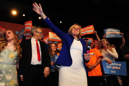 Alberta New Democratic (NDP) leader and Premier Rachel Notley, flanked by her daughter Sophie and husband Lou Arab, reacts to her loss at her election night party in Edmonton, Alberta, Canada, April, 16, 2019. REUTERS/Candace Elliott