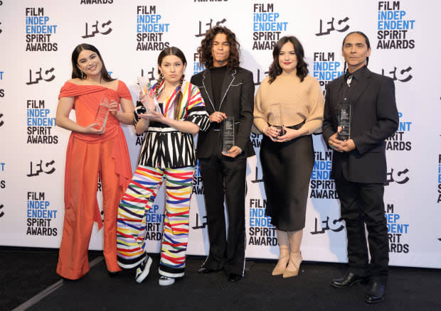 Devery Jacobs, Paulina Alexis, D’Pharaoh Woon-A-Tai, Sarah Podemski and Zahn McClarnon, winners of the Best Ensemble Cast Award for "Reservation Dogs," pose in the press room during the 2022 Film Independent Spirit Awards on March 06, 2022, in Santa Monica, California.<p><a href="https://www.gettyimages.com/detail/1381827142" rel="nofollow noopener" target="_blank" data-ylk="slk:Momodu Mansaray/Getty Images;elm:context_link;itc:0;sec:content-canvas" class="link ">Momodu Mansaray/Getty Images</a></p>