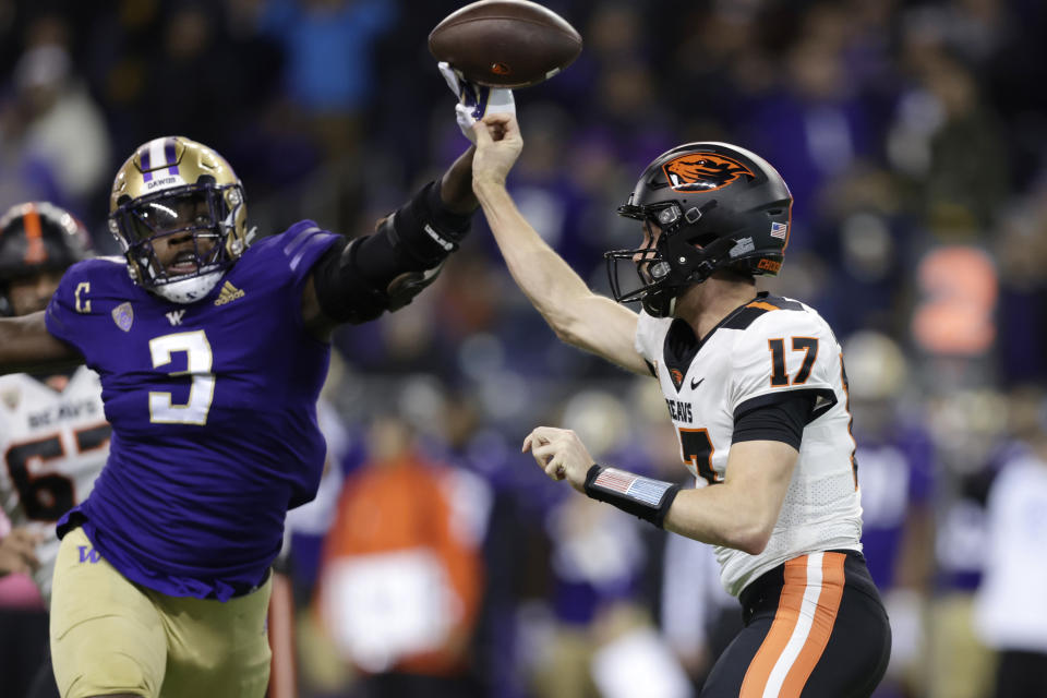 Washington defensive lineman Jeremiah Martin (3) blocks a pass from Oregon State quarterback Ben Gulbranson (17) during the first half of an NCAA college football game Friday, Nov. 4, 2022, in Seattle. (AP Photo/John Froschauer)