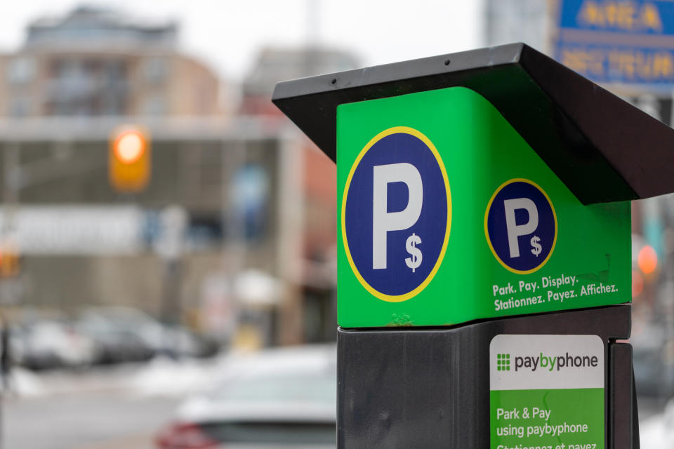 Ottawa, Canada - January 23, 2023: Parking meter on city street. Pay by phone available