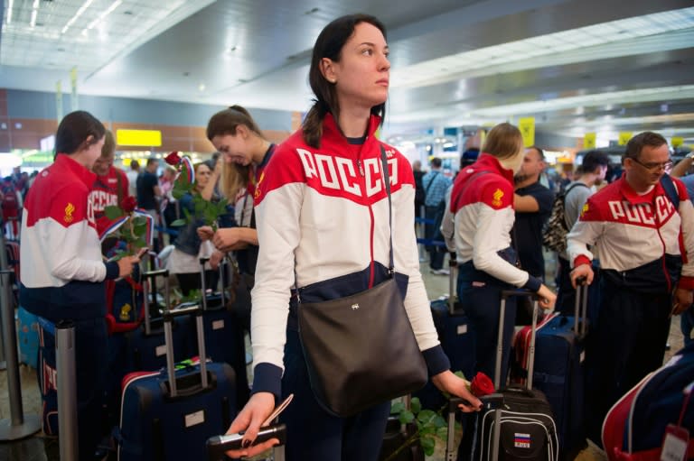 Russian athletes, members of the country's Olympics team, pictured before their departure for the Rio Games at Moscow's Sheremetyevo airport on July 28, 2016