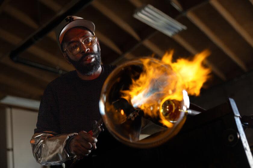 Glassblower Cedric Mitchell at work in his El Segundo studio.