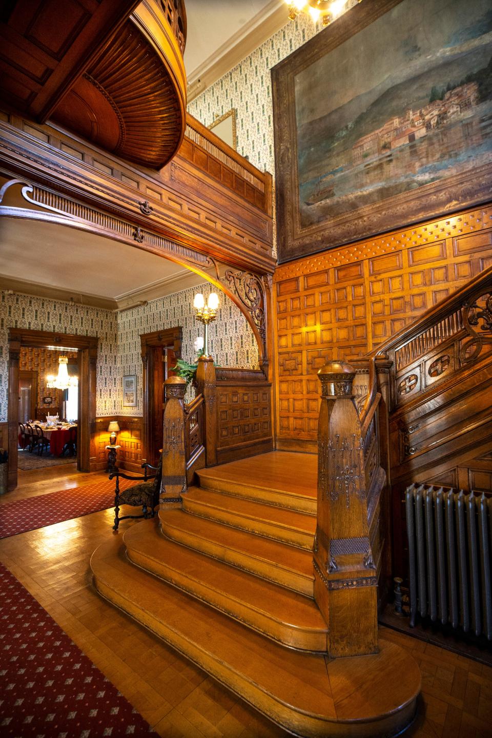 The elaborate hand carved wood staircase of the Conrad-Caldwell House Museum, on St. James Court in Louisville, Kentucky. Feb. 23, 2021