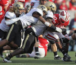 MADISON, WI - NOVEMBER 05: James White #20 of the Wisconsin Badgers is stopped by Albert Evans #32 (L) and Dwayne Beckford #3 of the Purdue Boilermakers at Camp Randall Stadium on November 5, 2011 in Madison Wisconsin. (Photo by Jonathan Daniel/Getty Images)