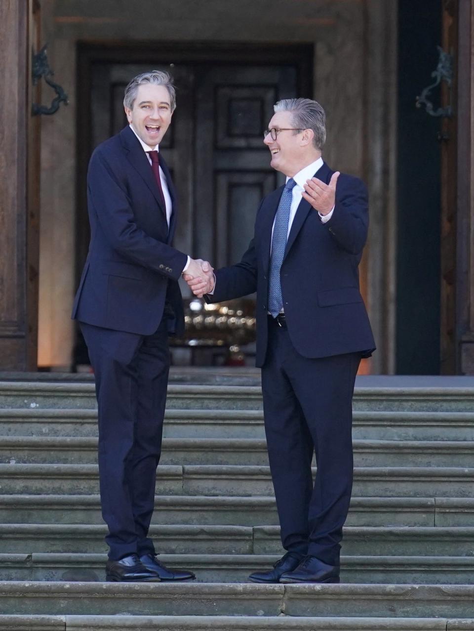 Starmer greets Harris at Blenheim Palace prior to the summit (via Reuters)
