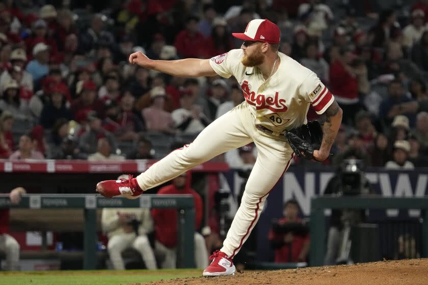 Los Angeles Angels relief pitcher Sam Bachman throws to the plate during the eighth inning of a baseball game.