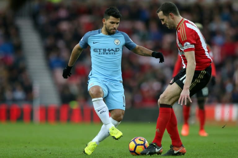 Manchester City's striker Sergio Aguero (L) vies with Sunderland's defender John O'Shea during the English Premier League football match between Sunderland and Manchester City at the Stadium of Light in Sunderland, north-east England on March 5, 2017