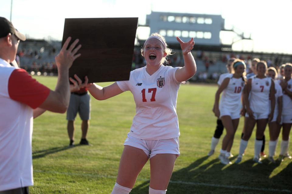 Chatham Glenwood's Ali Matthews claims the Class 2A supersectional plaque following a 5-0 victory over Troy Triad at the Glenwood Athletic Complex on Tuesday, May 30, 2023.