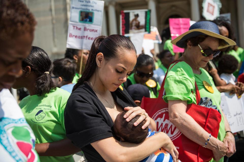 Milk Stork helps working mothers deliver breastmilk to their newborns. A mother is pictured breastfeeding her 2-month-old son, outside City Hall during a ralley to support breastfeeding in public on Aug. 8, 2014 in New York City.