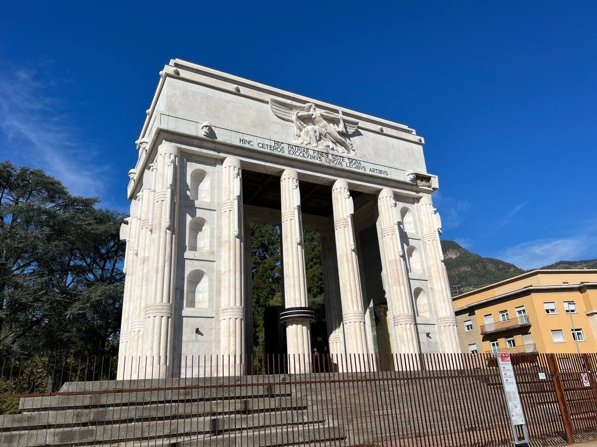 The Monument to Victory was unveiled in Bolzano, Italy, in 1928, on the site of an Austrian war memorial. The marble monument's soaring columns, Latin inscriptions and sculptures of Italian patriots were designed to glorify the triumph of Italy over the South Tyrol region surrounding Bolzano. By creating a permanent exhibit at the monument, the city has managed to end its attraction to the nationalist far right. (Megan Williams/CBC - image credit)