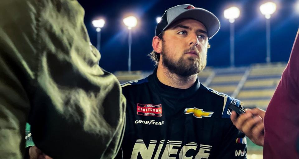 Kaden Honeycutt talks to reports after the NASCAR Craftsman Truck Series race at Kansas.