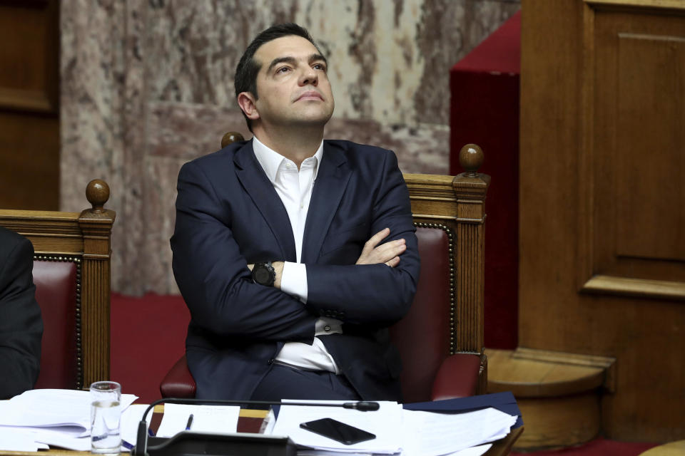 Greece's Prime Minister Alexis Tsipras reacts during a parliament debate about Prespa Agreement in Athens, Thursday, Jan. 24, 2019. Greek lawmakers are debating a historic agreement aimed at normalizing relations with Macedonia in a stormy parliamentary session scheduled to culminate in a Friday vote. (AP Photo/Yorgos Karahalis)