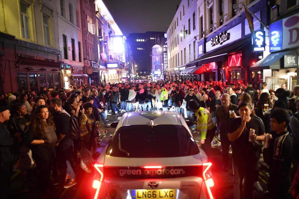 Crowds spilled out into the streets in Soho, London (AFP via Getty Images)