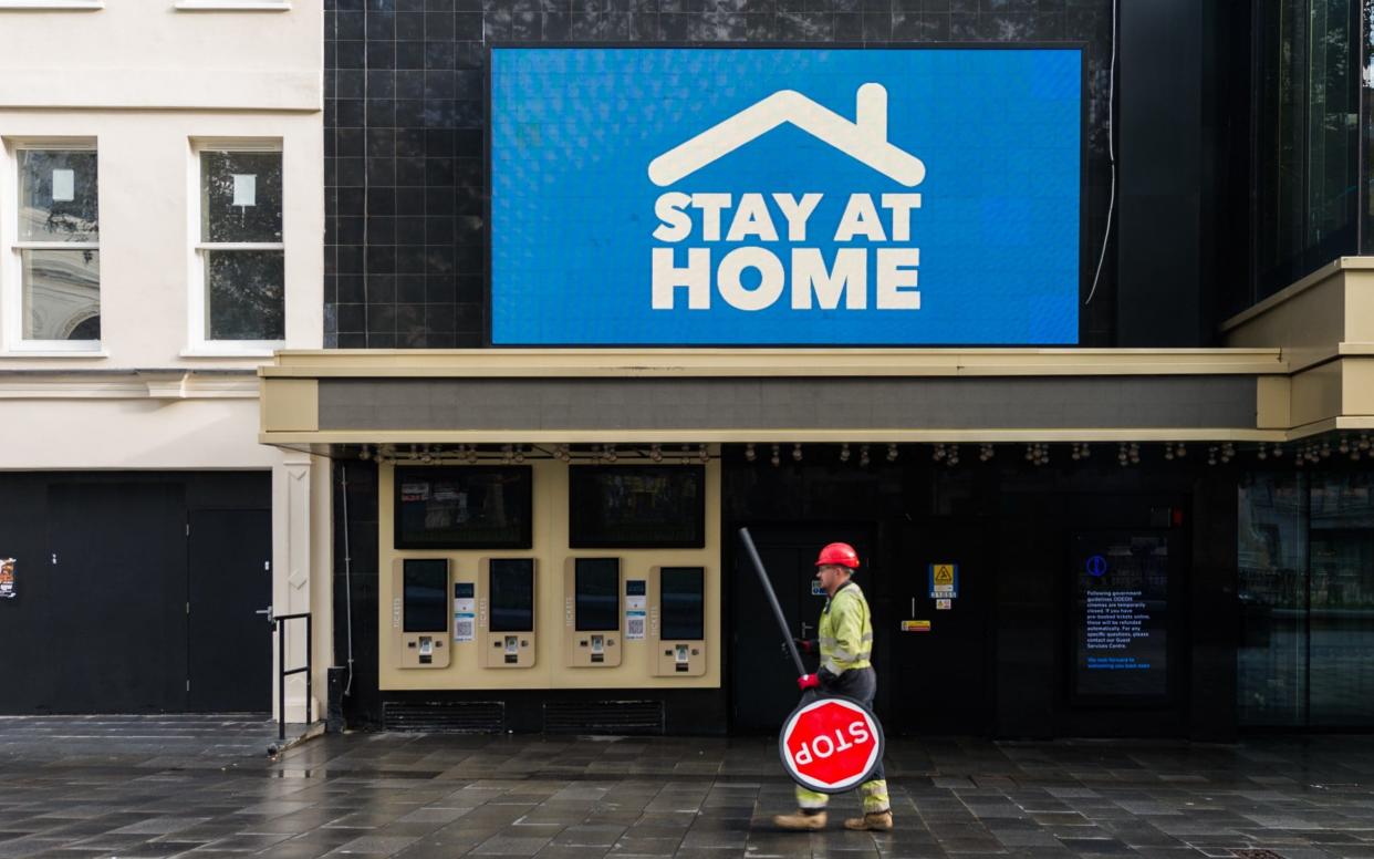 A construction worker with a STOP traffic sign  - Wiktor Szymanowicz/Barcroft Media 