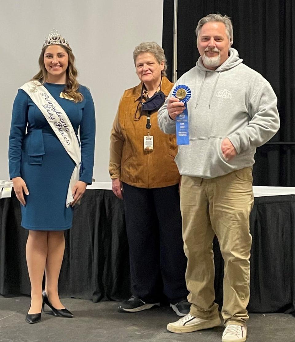 From left, Selina Horst, PA State Dairy Princess; Deputy Secretary for Strategic Initiatives and Market Development, Cheryl Cook; and James Regelsky, Calkins Creamery Cheesemaker.