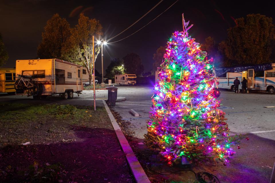 A Christmas Tree stands in the Project WeHope safe parking lot in East Palo Alto, California, on Dec. 21, 2019.