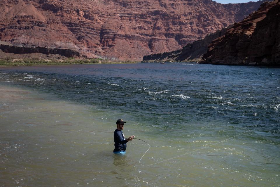 Amaury De Labbey (Boston) fishes for rainbow trout in the Colorado River, Sept. 9, 2022, at Lees Ferry, Arizona.