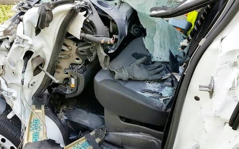 One-year-old Memphis was wedged in the foot well of the wrecked Vauxhall Vivaro  - Credit: Staffordshire FRS / SWNS.com