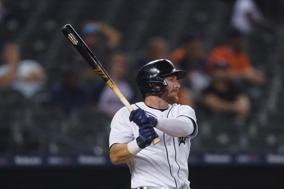 Detroit Tigers' Robbie Grossman watches his RBI sacrifice fly during the eighth inning of the team's baseball game against the Cleveland Indians, Wednesday, May 26, 2021, in Detroit. (AP Photo/Carlos Osorio)