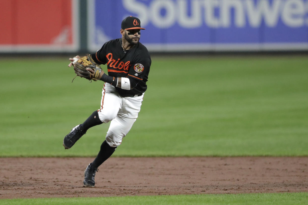 Baltimore Orioles shortstop Jonathan Villar fields a ground ball hit by Seattle Mariners' Shed Long during the third inning of a baseball game, Friday, Sept. 20, 2019, in Baltimore. (AP Photo/Julio Cortez)