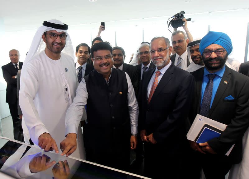 Dr Sultan Ahmed Al Jaber, UAE Minister of State and ADNOC Group CEO and Indian Oil Minister Pradhan switch on a button for the first cargo loading between ADNOC & ISPRL at the Panorama Digital Command Centre at the ADNOC headquarters in Abu Dhabi