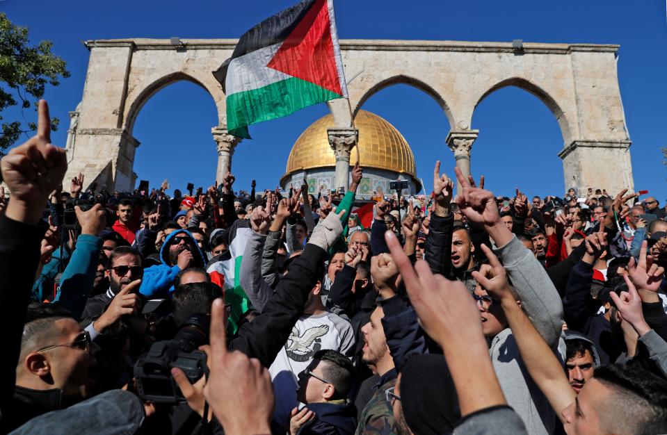 <p>Palestinian Muslim worshippers shout slogans during Friday prayer in front of the Dome of the Rock mosque at the al-Aqsa mosque compound in the Jerusalem’s Old City on Dec. 8, 2017. (Photo: Ahmad Gharabli/AFP/Getty Images) </p>