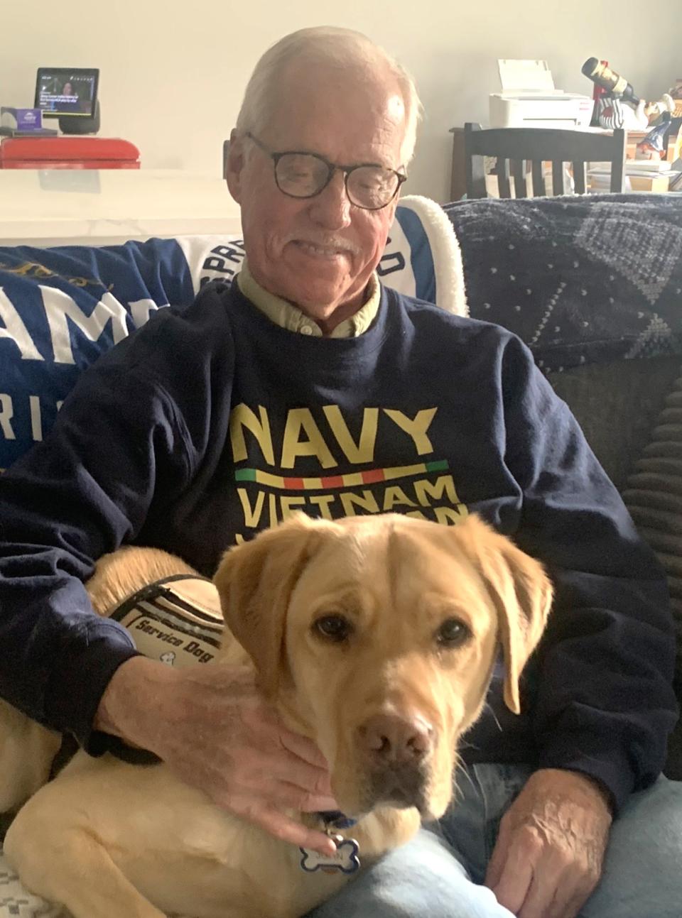 Vietnam veteran Mike Wesneski, 77, of Horseheads, suffered from PTSD for years until he was paired with service dog John, a yellow Labrador retriever, through an organization known as America's VetDogs. Wesneski said John's arrival changed his life.