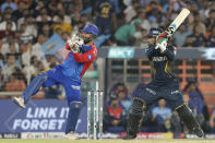 Delhi Capitals' captain Rishabh Pant, left, gestures as Gujarat Titans' Rashid Khan bats during the Indian Premier League cricket match between Delhi Capitals and Gujarat Titans in Ahmedabad, India, Wednesday, April 17, 2024. (AP Photo/Pravin Indrekar)