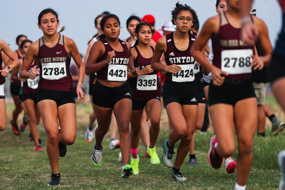 Sinton runners compete in a 3200 meter race at the UIL Region IV Cross Country Championships at Dr. Jack Dugan Family Soccer and Track Stadium in Corpus Christi, Texas on Monday, Oct. 24, 2022. Sinton qualified for state with a third place finish among the 4A girls teams.