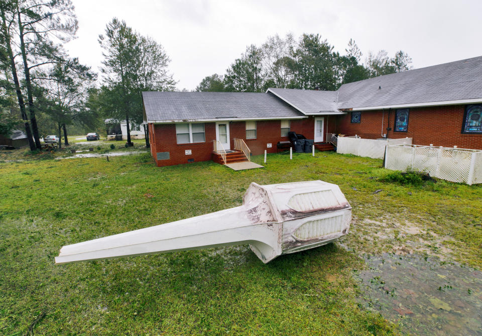 Bethlehem Missionary Baptist Church's steeple lies on the ground next to the church in Winnabow, North Carolina.