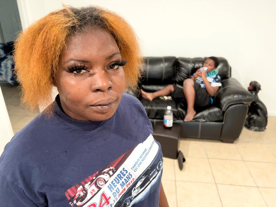 Bernadette Mohorn with her son Tyriyon Webster, 9, in their new apartment  recently in Belle Glade. They were forced out of a dilapidated apartment building in Pahokee when the county invoked emergency powers to shut the units down, and relocate tenants. Raw sewage was backing up into some of the units, and dangerous electrical systems were in place. Bernadette and Tyriyon are both sick from the mold in the old apartment.