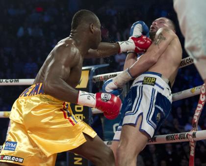 Adonis Stevenson, left, connects with a left in his win over Tony Bellew in November 2013. (AP)