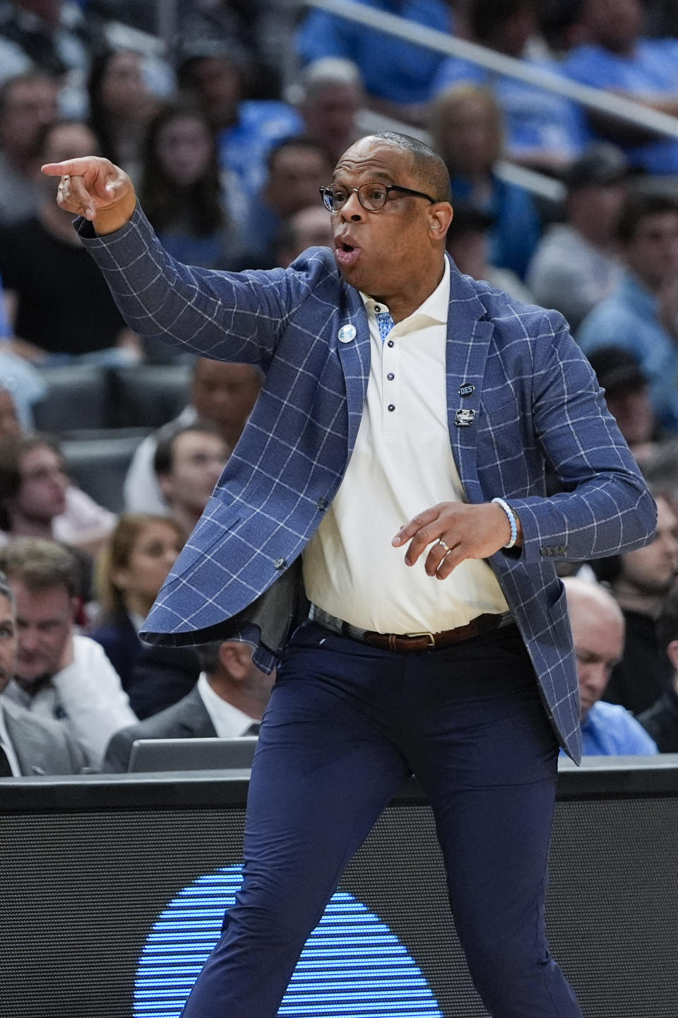 North Carolina head coach Hubert Davis gestures from the bench during the second half of a Sweet 16 college basketball game against Alabama in the NCAA tournament Thursday, March 28, 2024, in Los Angeles. (AP Photo/Ryan Sun)