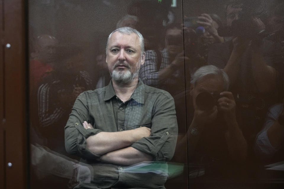 Igor Girkin also know as Igor Strelkov, the former military chief for Russia-backed separatists in eastern Ukraine, sits in a glass cage in a courtroom at the Moscow's Meshchansky District Court in Moscow, Russia, Friday, July 21, 2023. A prominent Russian hard-line nationalist who accused President Vladimir Putin of weakness and indecision in Ukraine was detained Friday on charges of extremism, a signal the Kremlin has toughened its approach with hawkish critics after last month's abortive rebellion by the Wagner mercenary company. (AP Photo/Alexander Zemlianichenko, Pool)