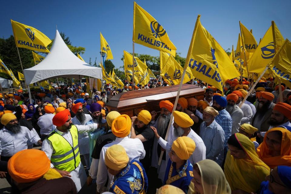 Mourners carry the casket of Sikh community leader and temple president Hardeep Singh Nijjar during Antim Darshan (AP)